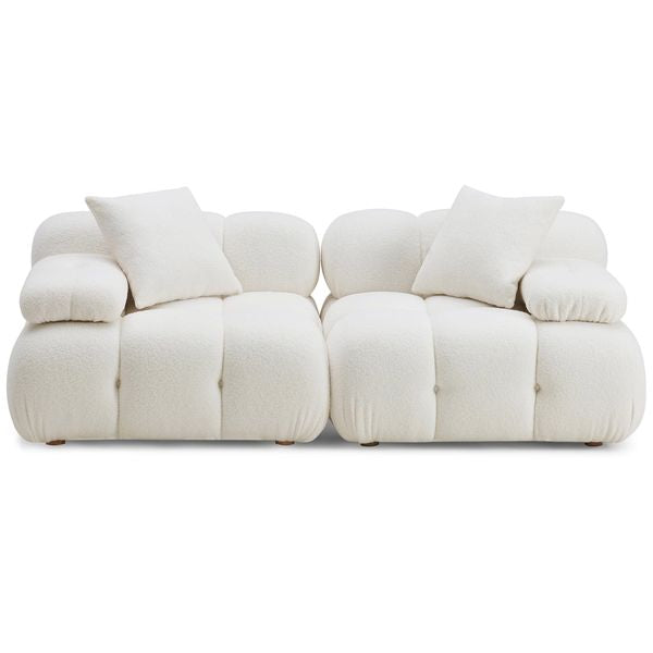 Sofa tapicerowana o nowoczesnym konturze z harmonijnym wykonczeniem w odcieniu bieli